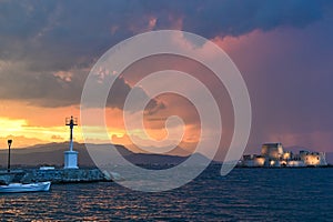 Sunset over Bourtzi water fortress in Nafplio, Greece photo