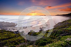 Sunset over brenton-on-sea beach in South Africa