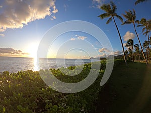 Sunset over calm ocean Hawaii shore