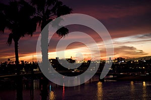 Sunset over canals and luxury homes.