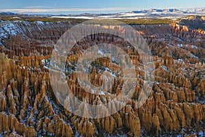 Sunset over canyon slopes covered in snow, Bryce Canyon National