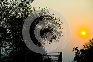 Sunset over car and road in countryside