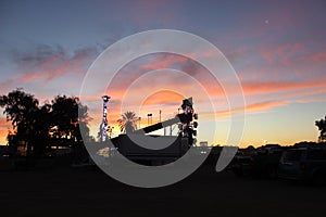 Sunset over carnival rides