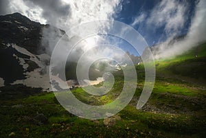 Sunset over Caucasus misty Mountains. summer season