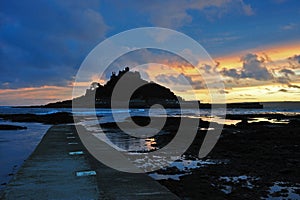 Sunset over causway leading to St Michaels Mount photo