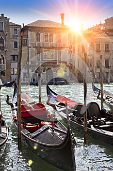 A sunset over the channel and gondolas, Venice, Italy