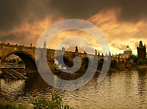 Sunset over Charles Bridge in Prague photo