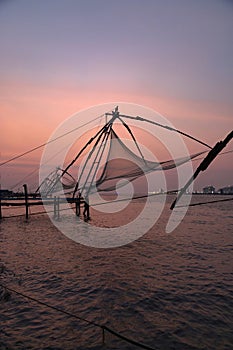 Sunset over Chinese fishing net at sunrise in Cochin Fort Kochi, Kerala, India