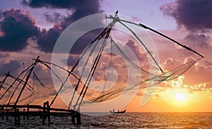 Sunset over Chinese Fishing nets in Cochin photo