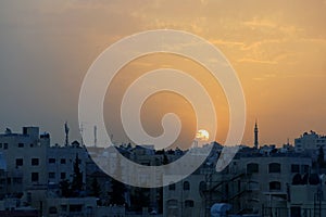 Sunset over the city of AMMAN in Jordan in the Middle East photo