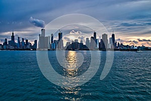 Sunset over the city of Chicago skyline with added interest in cloudscape and reflections.