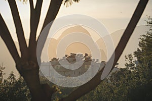 Sunset over the city with mountains in the background (Antalya, Turkey) - Turkish public housing