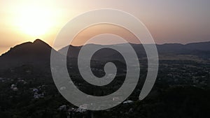 Sunset over coast of Corfu with Saint George mountain, Greece.