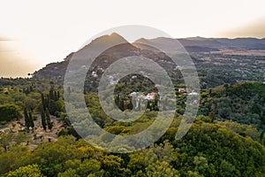 Sunset over coast of Corfu with Saint George mountain, Greece