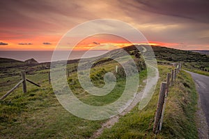 Sunset over countryside and ocean