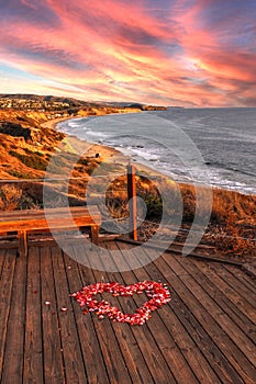 Sunset over Crystal Cove State Park Beach and a heart of rose pe