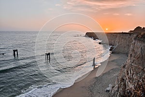 Sunset over Davenport Pier Beach