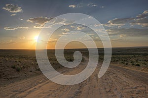 Sunset over dirt road leading to Chaco Culture National Park