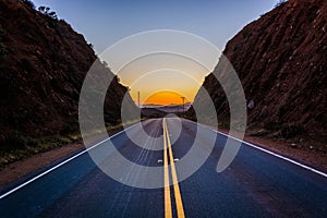 Sunset over distant mountains and Escondido Canyon Road, in Agua photo