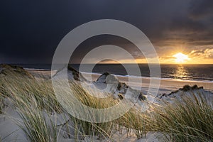 sunset over Dutch sea beach