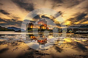 Sunset over Eilean Donan Castle in Scotland photo