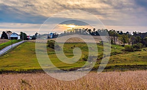 Sunset over farm fields and hills in Lancaster County, Pennsylvania.