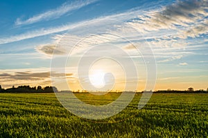 sunset over farm fields, rural farm landscape in Europe