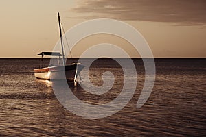 Sunset over fishing boats and commercial tankers, Tombeau Bay, Mauritius