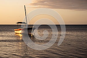 Sunset over fishing boats and commercial tankers, Tombeau Bay, Mauritius