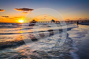 Sunset over the fishing pier and Gulf of Mexico in Fort Myers Be