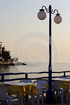 Sunset over fishing village in greece