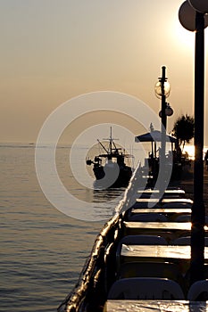 Sunset over fishing village in greece