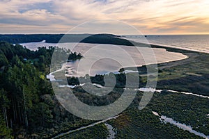 Sunset over Floras Lake and ocean