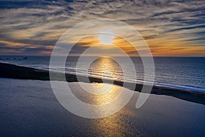 Sunset over Floras Lake and ocean