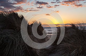 Sunset over Formby Beach through dunes
