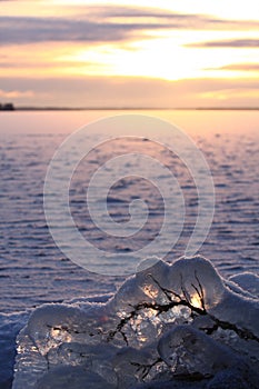 Sunset over frozen lake