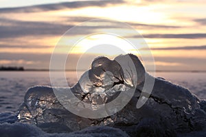 Sunset over frozen lake