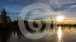 Sunset over Frozen Urban Lake