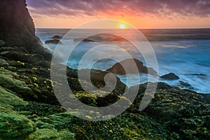 Sunset over Gray Whale Cove State Beach.