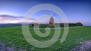 Sunset over Halnaker windmill in the South Downs National Park, UK