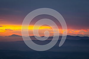 Sunset over hills in countryside