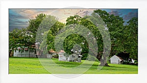 Sunset Over Historic Homestead Framed With White Mat