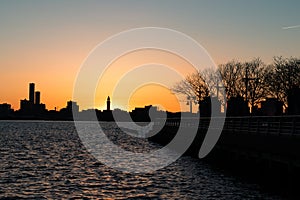 Sunset over the Hoboken New Jersey Skyline along the Hudson River seen from the Riverfront of New York City