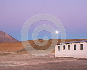 Sunset over a home in bolivian mountain range