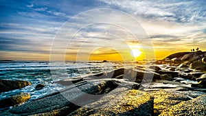 Sunset over the horizon of the Atlantic Ocean at Camps Bay near Cape Town