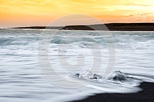 Sunset over ice gems on Diamond Beach in Iceland