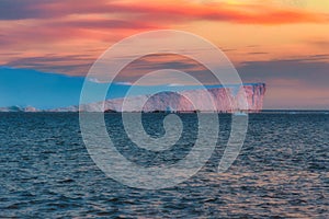 Sunset over an iceberg in the Icefjord, Greenland