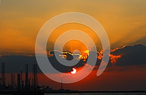 Sunset over industrial seaport