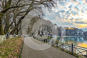 Sunset over Ioannina city and lake Pamvotis. Street for pedestrians and bicycles by the lake. Epirus, Greece