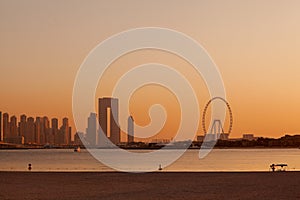 Sunset over the island of Blue Waters with the famous Dubai Eye Ferris wheel
